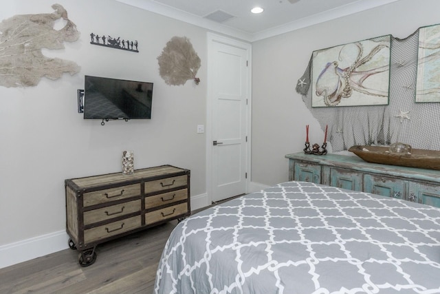 bedroom featuring ornamental molding, recessed lighting, baseboards, and wood finished floors