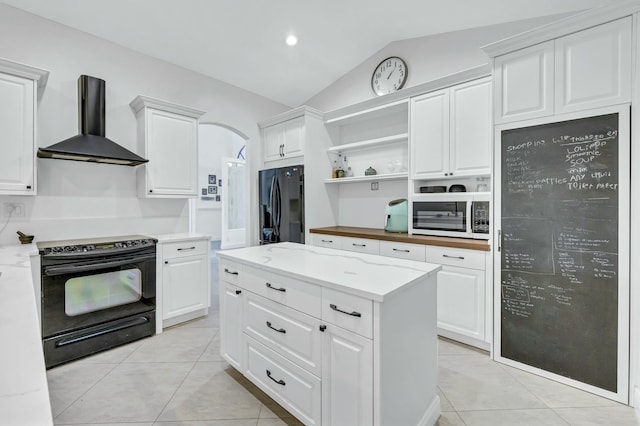 kitchen featuring white cabinets, wall chimney range hood, vaulted ceiling, black appliances, and open shelves