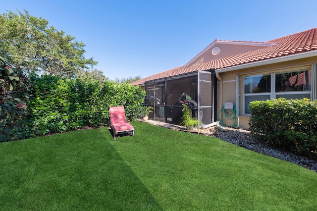 view of yard featuring a sunroom