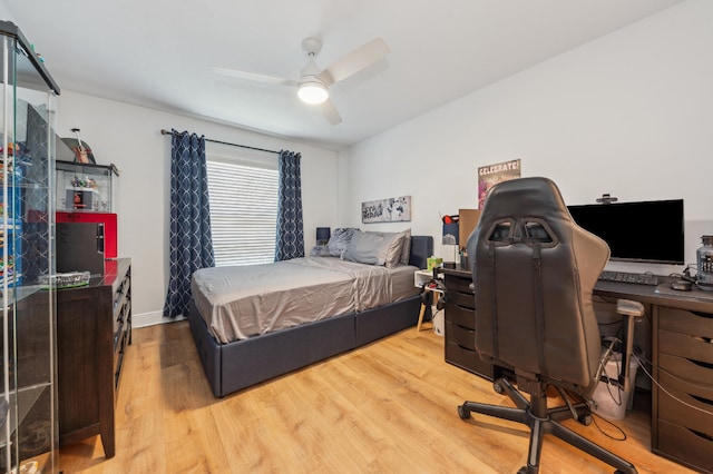 bedroom featuring wood finished floors and a ceiling fan