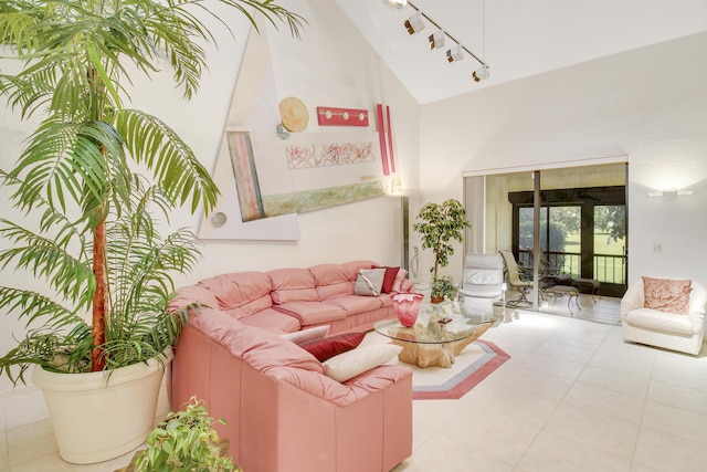 living area featuring high vaulted ceiling and rail lighting