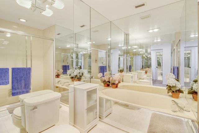 bathroom featuring a stall shower, visible vents, toilet, and a bath