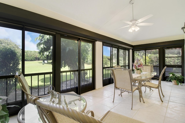 sunroom featuring vaulted ceiling and a ceiling fan