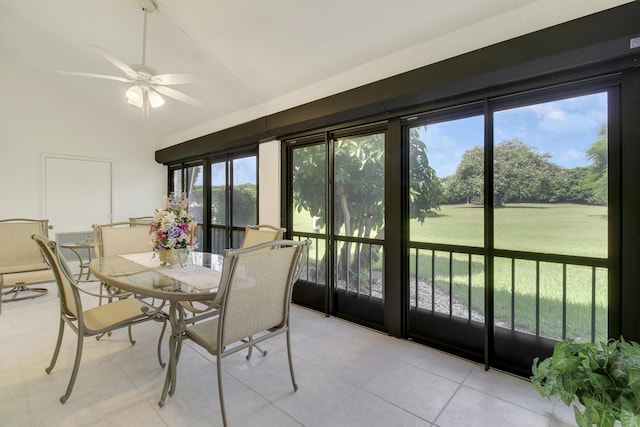 sunroom featuring lofted ceiling and ceiling fan