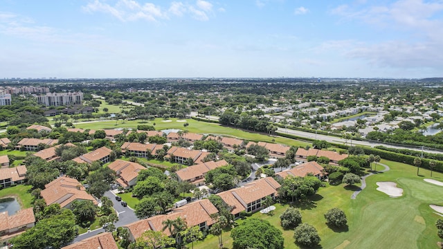 bird's eye view with view of golf course and a residential view