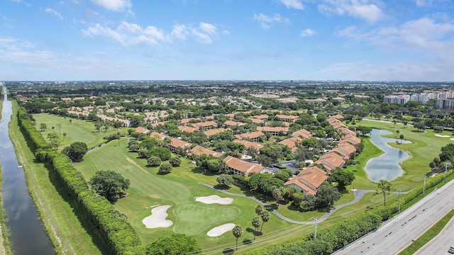 bird's eye view featuring a water view and golf course view