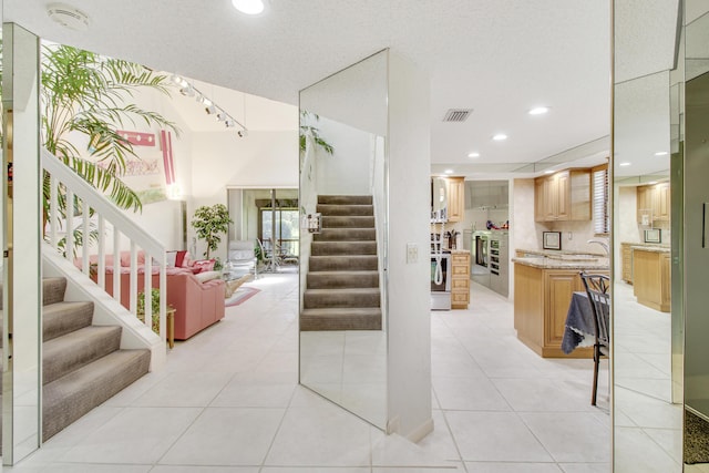 stairs featuring recessed lighting, visible vents, and tile patterned floors