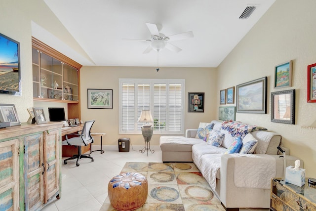 interior space featuring light tile patterned floors, visible vents, baseboards, lofted ceiling, and ceiling fan