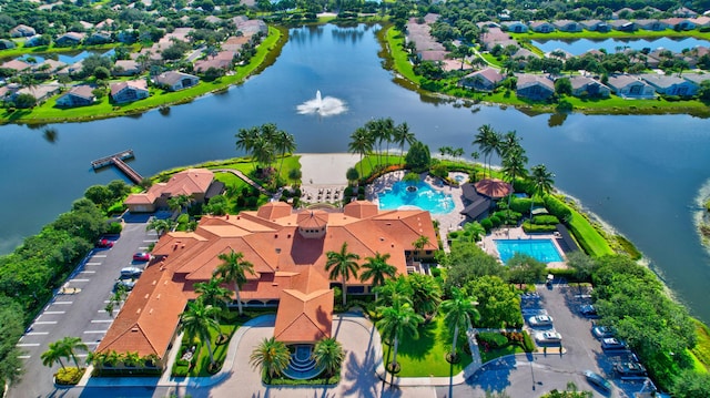 birds eye view of property featuring a residential view and a water view