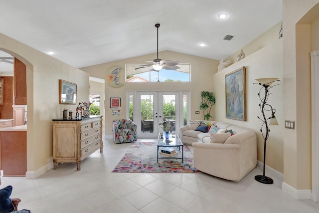 living room with arched walkways, ceiling fan, visible vents, vaulted ceiling, and french doors