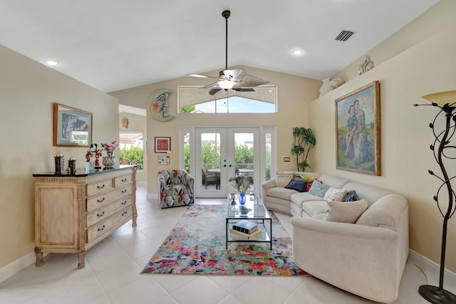 living area featuring light tile patterned flooring, visible vents, baseboards, vaulted ceiling, and french doors