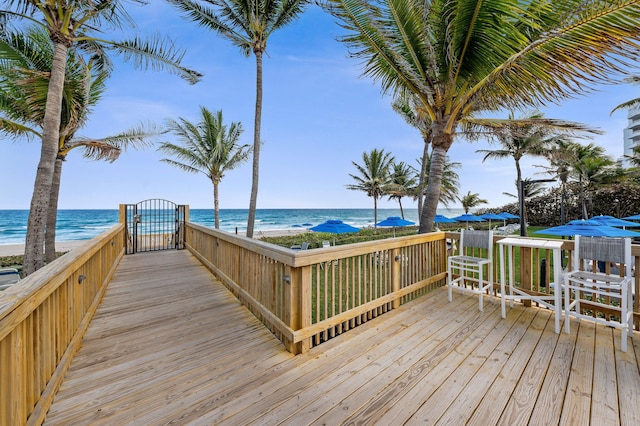 wooden terrace featuring a water view