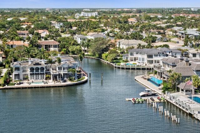 birds eye view of property with a water view and a residential view