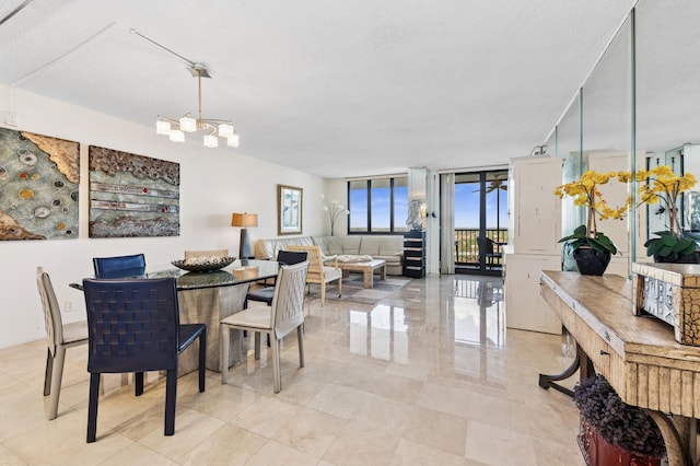 3420 S Ocean Blvd Unit 15V, Highland Beach, FL 33487 - dining room featuring a chandelier and expansive windows