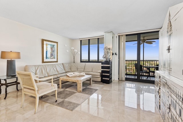 living area featuring floor to ceiling windows