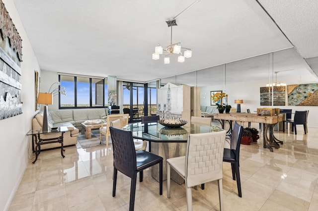 dining area featuring baseboards, floor to ceiling windows, a chandelier, and a textured ceiling