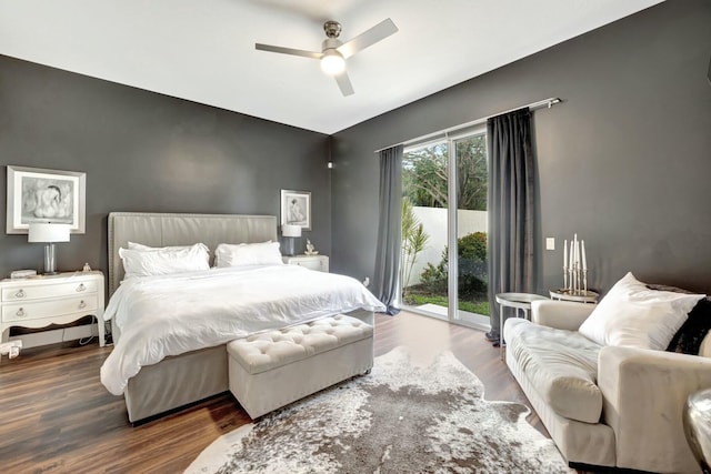 bedroom featuring access to outside, a ceiling fan, and wood finished floors