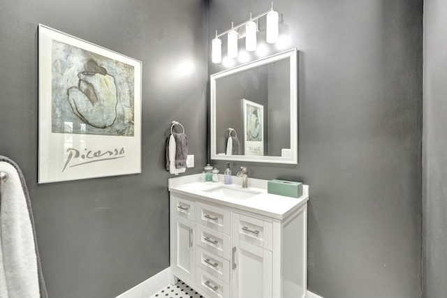 bathroom with vanity and baseboards