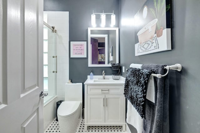 bathroom featuring toilet, shower / tub combination, and vanity