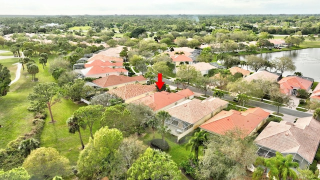 birds eye view of property with a residential view and a water view