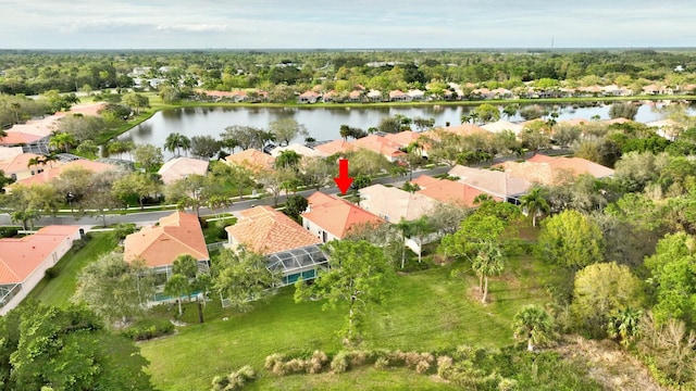 drone / aerial view with a water view and a residential view