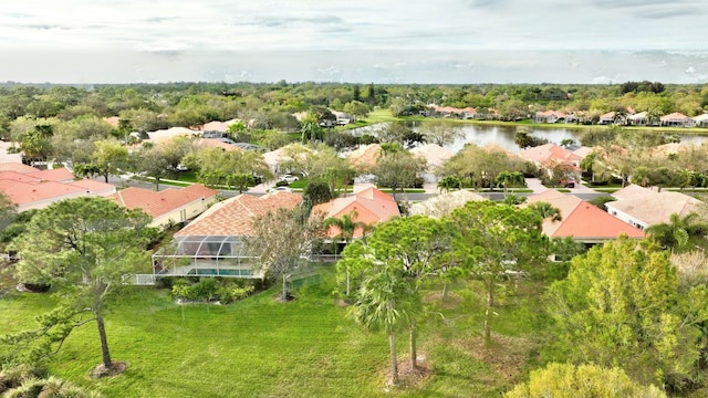 birds eye view of property with a water view and a residential view