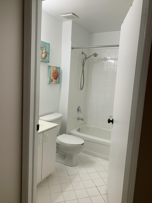 bathroom with toilet, tile patterned flooring, visible vents, and vanity