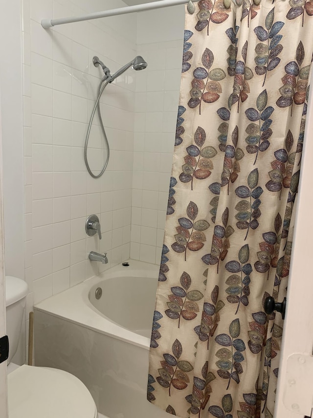 full bath featuring toilet and shower / tub combo with curtain