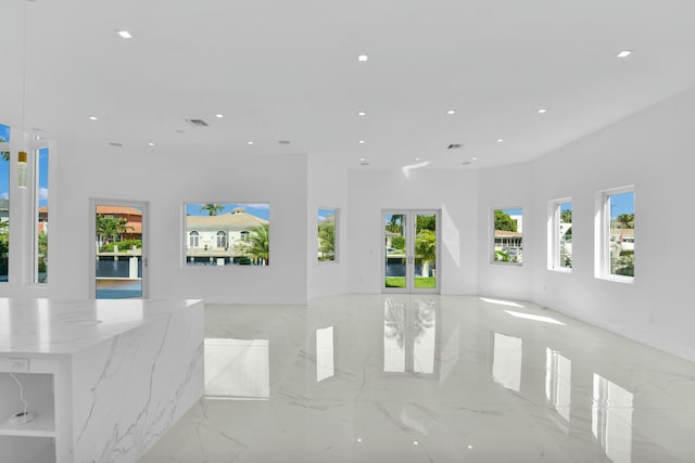 living room featuring recessed lighting and marble finish floor