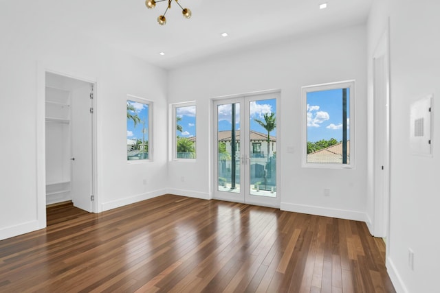 unfurnished room featuring dark wood-type flooring, recessed lighting, and baseboards