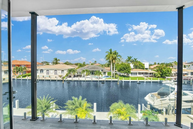 view of water feature with a residential view and a boat dock