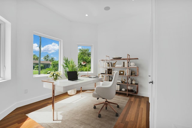 office area featuring baseboards, wood finished floors, and recessed lighting