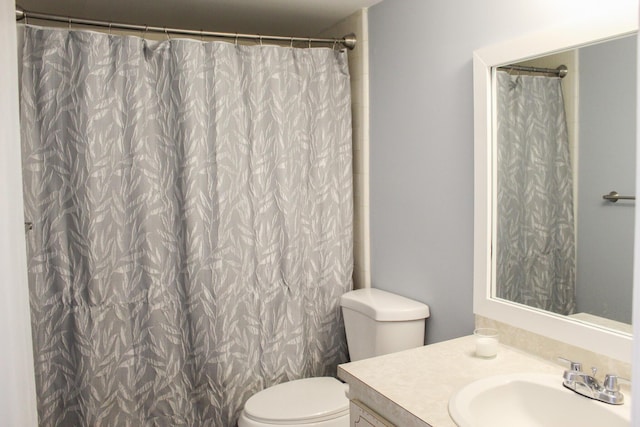 full bathroom with vanity and toilet