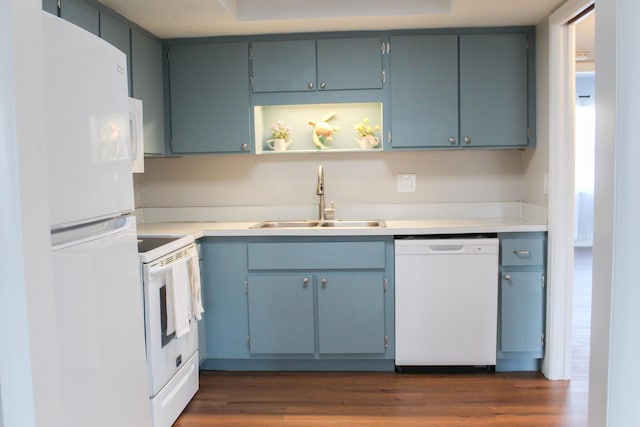 kitchen with white appliances, a sink, light countertops, dark wood-style floors, and open shelves