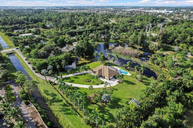 birds eye view of property with a wooded view