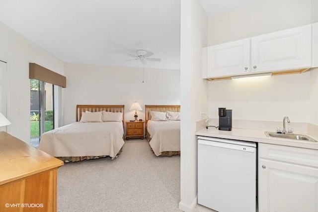 bedroom featuring light colored carpet and a sink