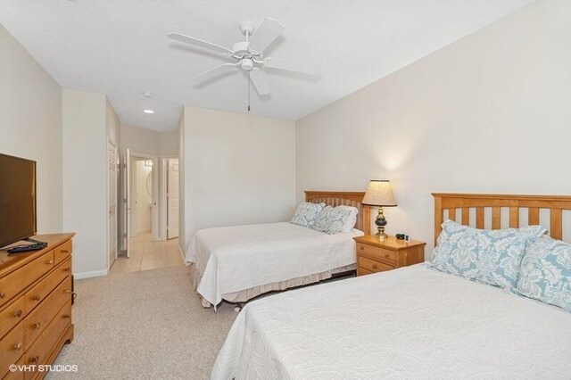 bedroom featuring a ceiling fan and light colored carpet