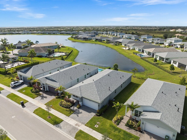 birds eye view of property featuring a residential view and a water view