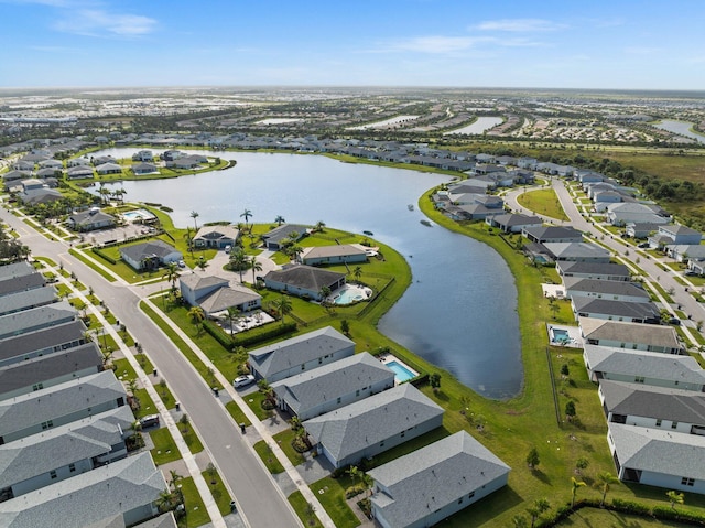 bird's eye view featuring a water view and a residential view