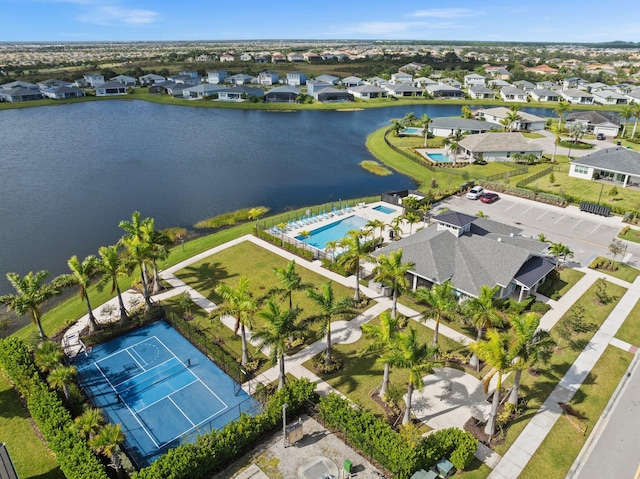 bird's eye view featuring a water view and a residential view