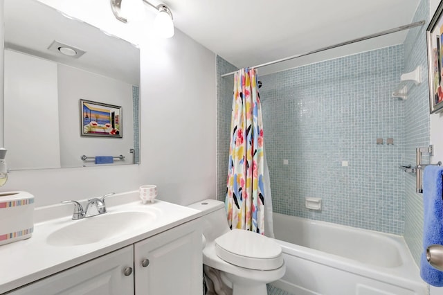 bathroom featuring toilet, shower / bathtub combination with curtain, and vanity