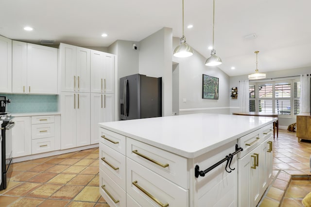 kitchen featuring pendant lighting, lofted ceiling, recessed lighting, light countertops, and refrigerator with ice dispenser