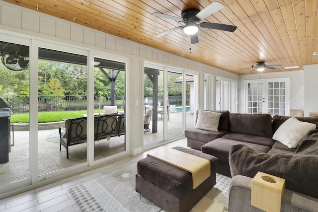 interior space with french doors, wood finished floors, wood ceiling, and a ceiling fan