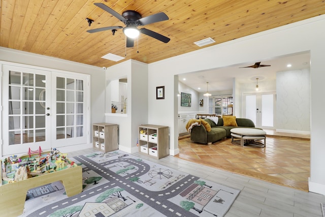 living area featuring wood ceiling, visible vents, baseboards, and french doors