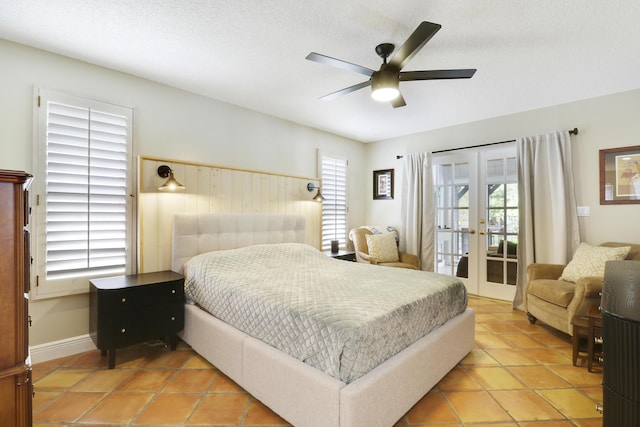 bedroom featuring access to outside, multiple windows, a ceiling fan, and french doors