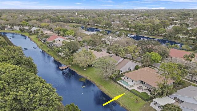 drone / aerial view featuring a water view and a residential view