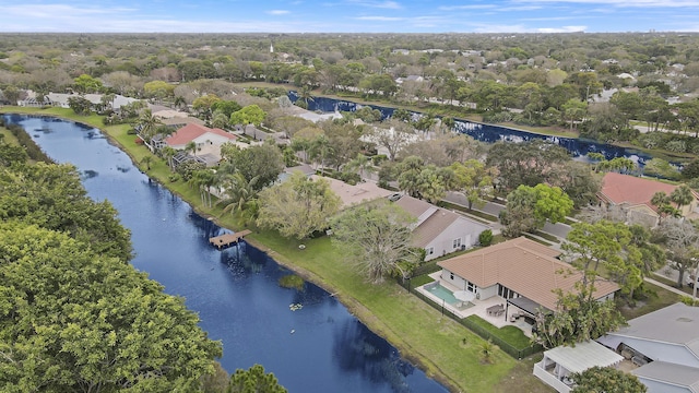 drone / aerial view with a residential view and a water view