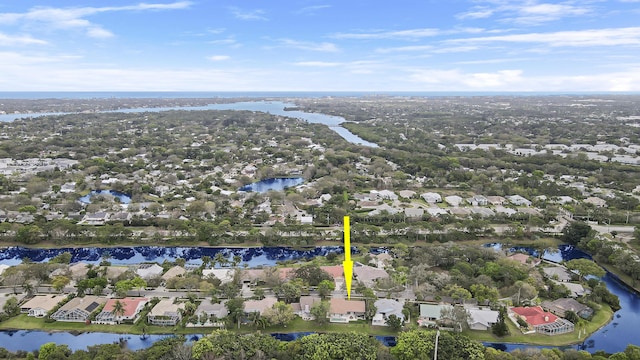 birds eye view of property with a water view and a residential view