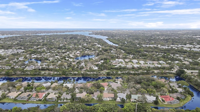 drone / aerial view featuring a water view and a residential view