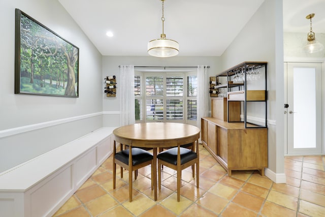 dining space with recessed lighting, vaulted ceiling, and light tile patterned flooring